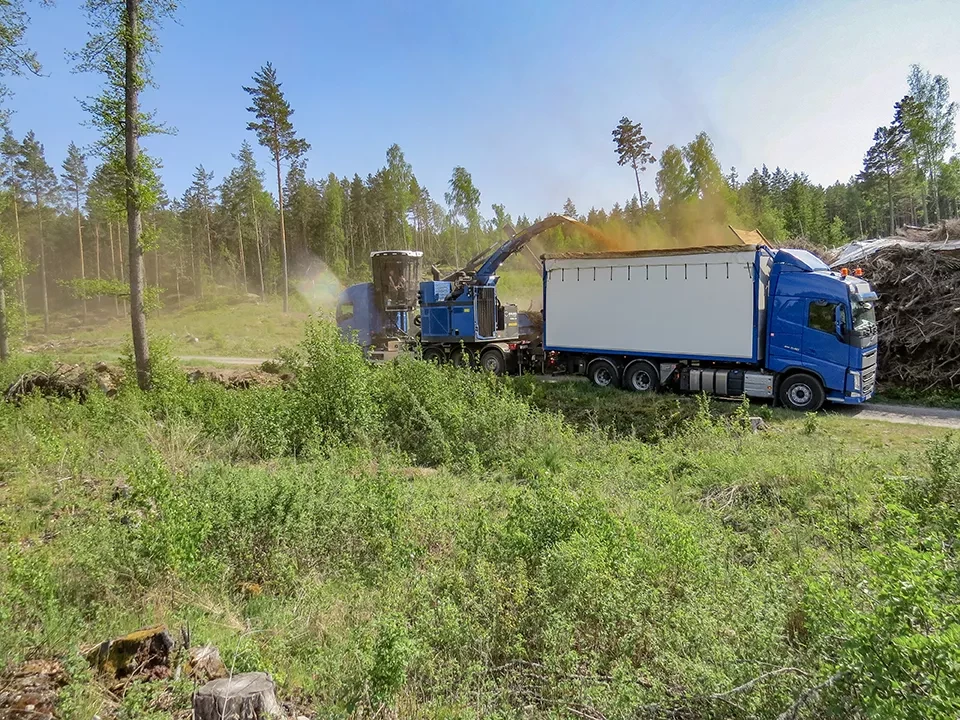 Mobile chipper in forest