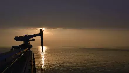 Ship unloader in sunset