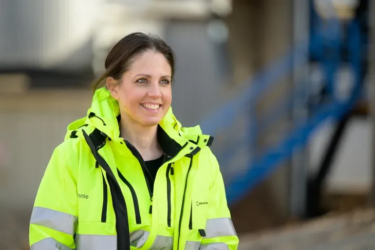 a woman in a high vis jacket